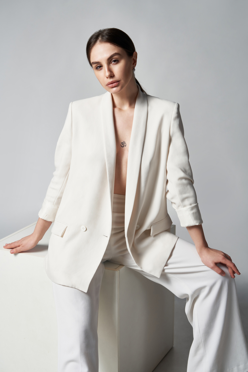 Fashion Portrait of Beautiful Woman in White Blazer